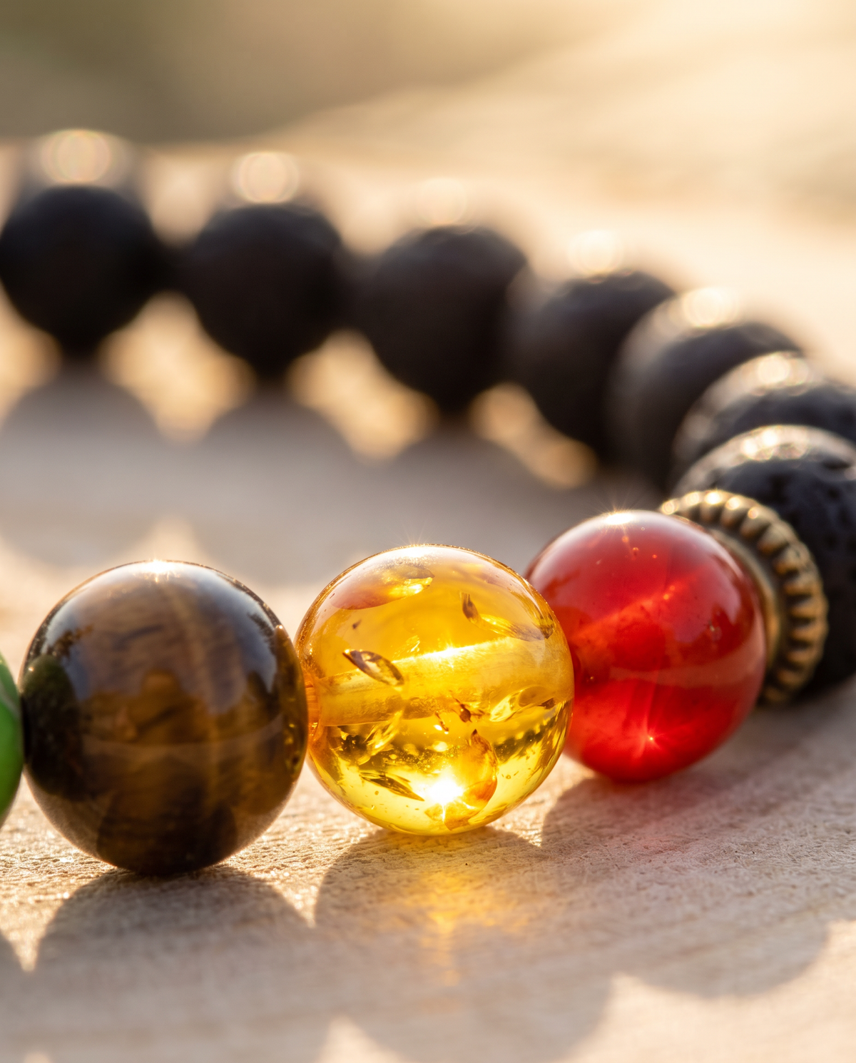 Macro of the yellow chakra stone on the bracelet, warm energising light