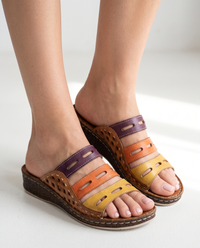 Sunslides Brown sandals worn on feet