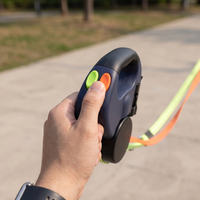 Green and orange brake buttons under the thumb