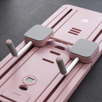Close up of the sliding pads on the pink board